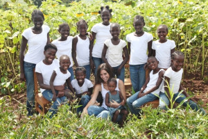 Katie Davis with her 14 adopted daughters in Uganda.
