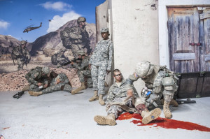 This is a combat life-saving course. Soldiers mimic serious injuries ...