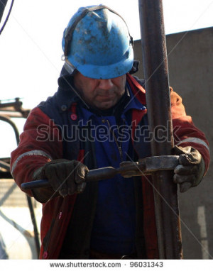 - FEB. 4: A roughneck maintains a drilling rig at a producing oil ...