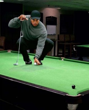 tiger woods playing golf on pool table