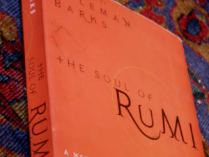 Rumi quotes in bold arabesque (orange).