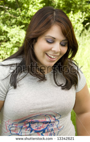 pretty Puerto Rican woman in her early twenties laughing.