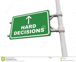 Hard decisions ahead text on green board against a white background ...