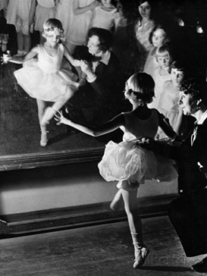 Ballet Teacher Advising Little Girl and Group of Dancers at Ballet ...