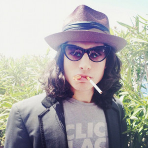 Ezra Miller in Tom Ford sunglasses.