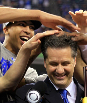 Anthony Davis (left) messes up the hair of head coach John Calipari ...