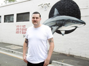 ... against the WA shark cull with a mural including a Ricky Gervais quote