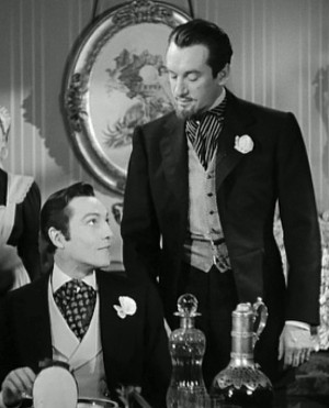 Dorian Gray (Hurd Hatfield) looks up at Lord Henry Wotton (George ...