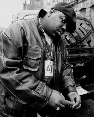 Rapper Notorious B.I.G., aka Biggie Smalls, aka Chris Wallace, rolls a ...