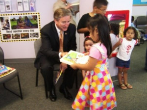 Rep John F Tierney reads with children at the Lynn Community