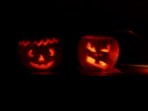 When the lights go out, the pumpkins get scary! Good and evil pumpkin.