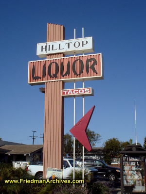 ... storefront sign from the 1950's - now it's aliquor store. Go figure