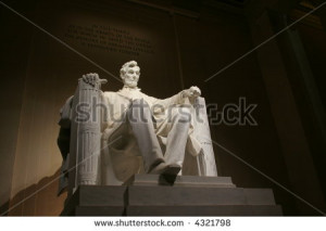 statue within the lincoln memorial at night - stock photo