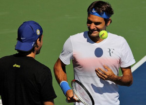 Roger Federer is all smiles during a practice session at Flushing ...
