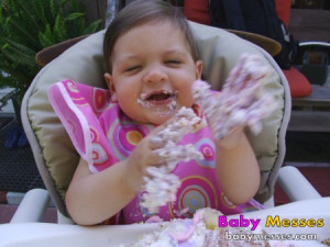 Baby Girl Eating Birthday Cake