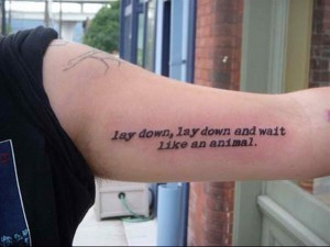 tattoo-quotes-lay down lay down and wait like an animal
