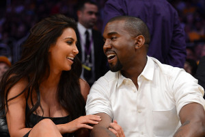 Kim Kardashian and Kanye West attend a Los Angeles Lakers' game.