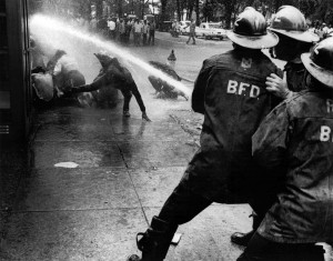 July 15, 1963 file photo, firefighters aim their hoses on civil rights ...