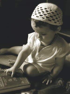muslim-little-boy-touches-a-book-of-quran1.jpg