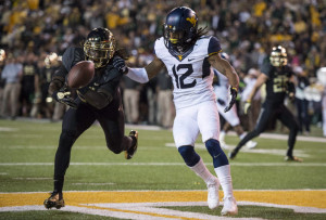 breaks up a pass intended for West Virginia Mountaineers wide receiver ...