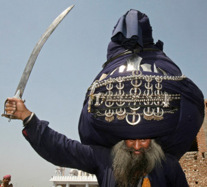 Balwant Singh, a 'Nihang' or Sikh warrior, wearing an 800-metre-long ...