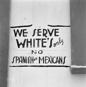 sign that states: We serve whites only, no spanish or mexicans