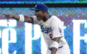 Dodgers' Yasiel Puig celebrates after he fired a bullet to first base ...
