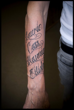 cursive font tattoo on sleeve