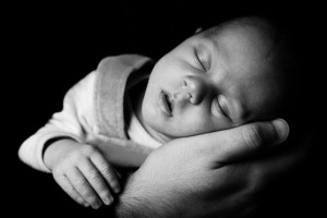 Sleeping Baby On A Hand by Vera Kratochvil