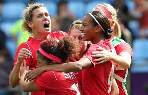 Christine Sinclair (L) celebrates with her team their bronze medal ...