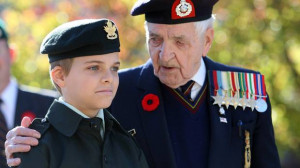 Veteran Bob Kennedy chats with Army Cadet Tristen Garnhum, 12, after ...