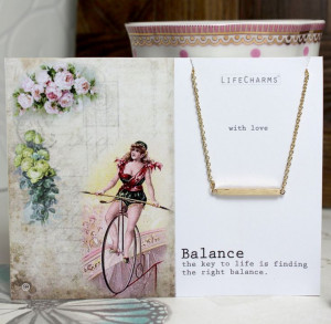 Balance quote with delicate balance bar necklace.