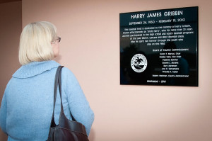 Mrs. Gribbin admires the plaque in memory of her late husband Harry ...