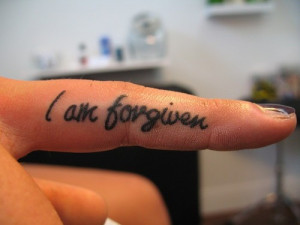 See more I am forgiven ink tattoo on side finger