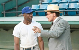 Jackie Robinson (Chadwick Boseman) is recruited by Brooklyn Dodgers ...