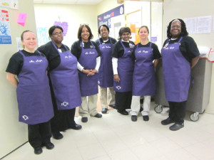 ... and white aprons they received for Food Service Appreciation Day