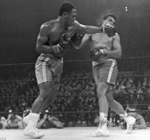 Champion: Smokin' Joe Frazier, left, beat Muhammed Ali, right, in the ...