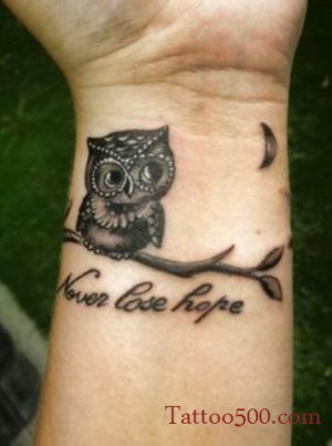 cute small owl tattoo