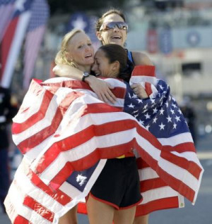 ... , second, and Kara Goucher, third, embrace after running in the U.S