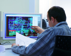 Designer pointing at a computer screen