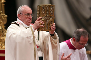 30: Pope Francis holds the gospel as he attends the Holy Saturday ...