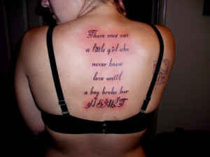 ... Who Never Knew Love Until A Boy Broke Her Heart - Quote Tattoo On Back