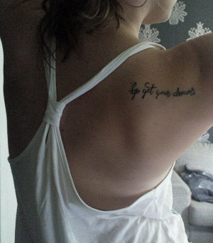 Go get your dreams” quote tattoo inked on the back of this girls ...