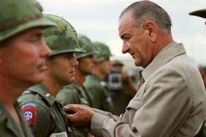 President Lyndon B. Johnson awards the Distinguished Service Cross to ...
