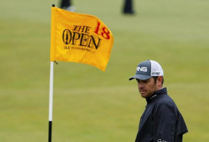 Louis Oosthuizen of South Africa walks up to hit his birdie putt on ...