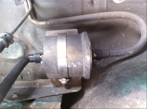 ... screw down clamp from the fuel filter and pull it from the bracket