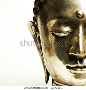 half of a buddha's face on white background - stock photo
