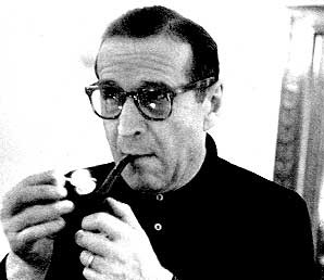 Lighting one of his 46 pipes Simenon ponders new Maigret book he was