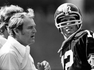 Chuck Noll (left) talks to quarterback Terry Bradshaw during a 1976 ...