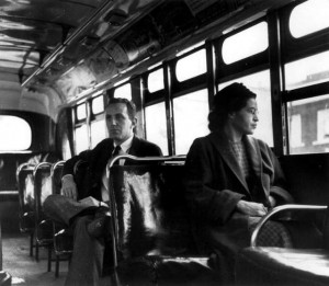 Rosa Parks sits in the front of a city bus as a Supreme Court ruling ...
